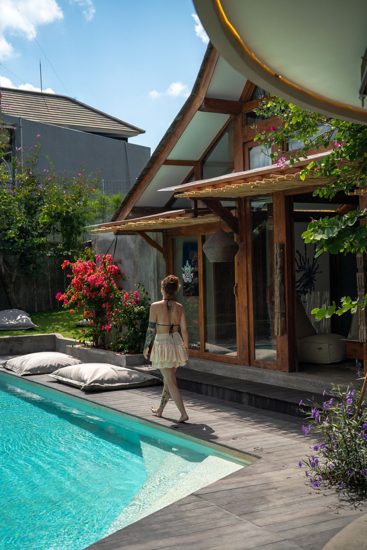 The teak gable rising above the garden